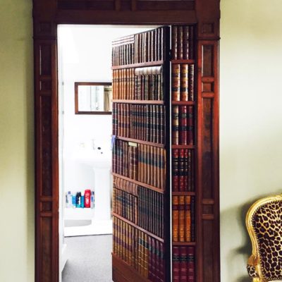 Faux book bathroom door private residence